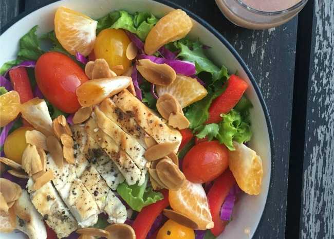 Grilled Chicken Salad accompanied by Seasonal Fruit